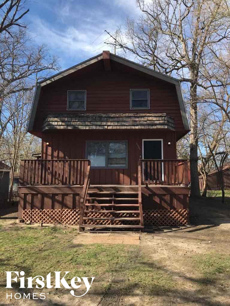 a cabin with a porch and a deck
