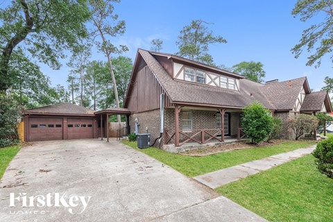 a home with a garage and a driveway in front of it