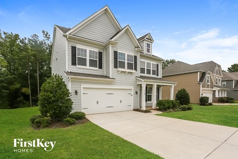 A large house with a garage is for sale by FirstKey Homes.