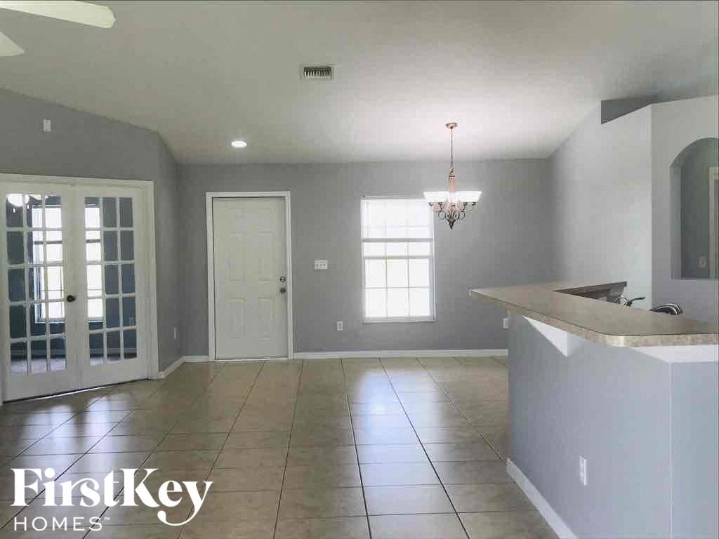 A kitchen with a counter and a window.