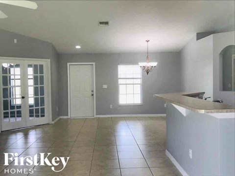 A kitchen with a counter and a window.