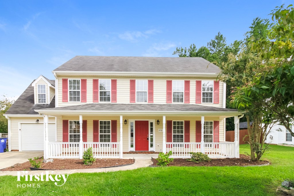 A two-story house with red and white stripes.