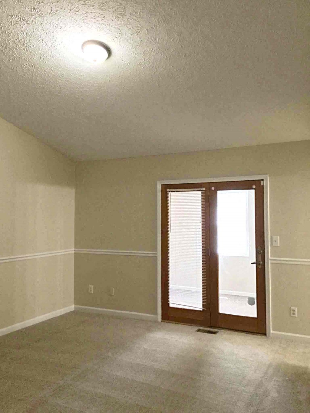 A room with a door and a window.