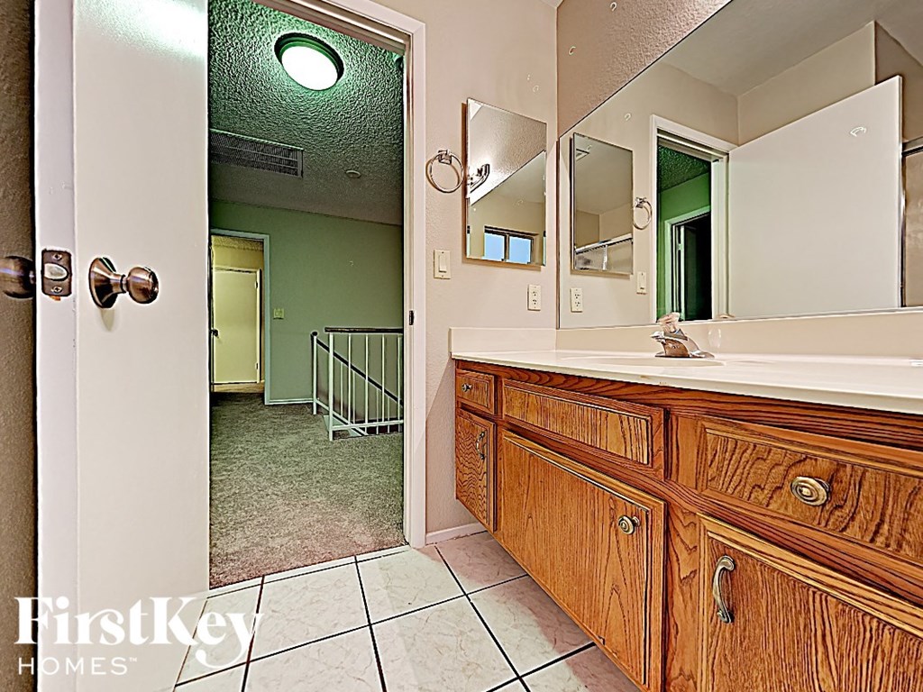 a bathroom with a sink and a mirror