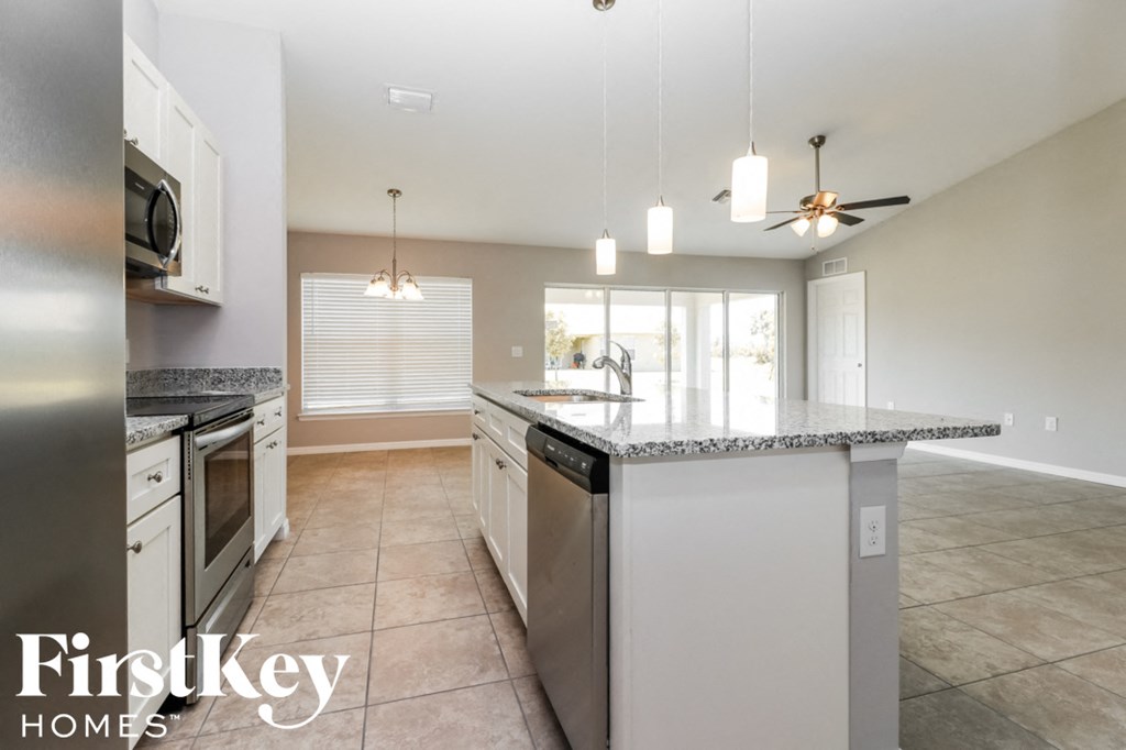 a kitchen with a counter top and a sink