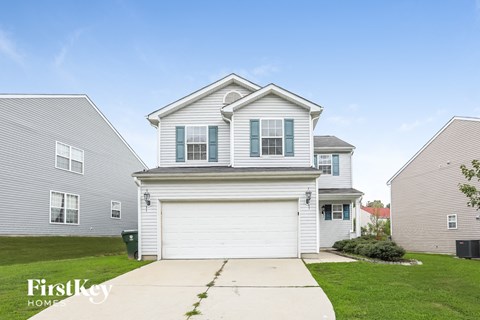 a white house with a white garage door