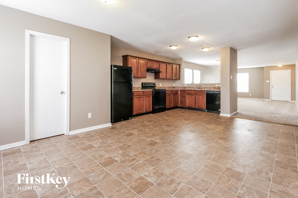 the kitchen is open to the dining room and living room
