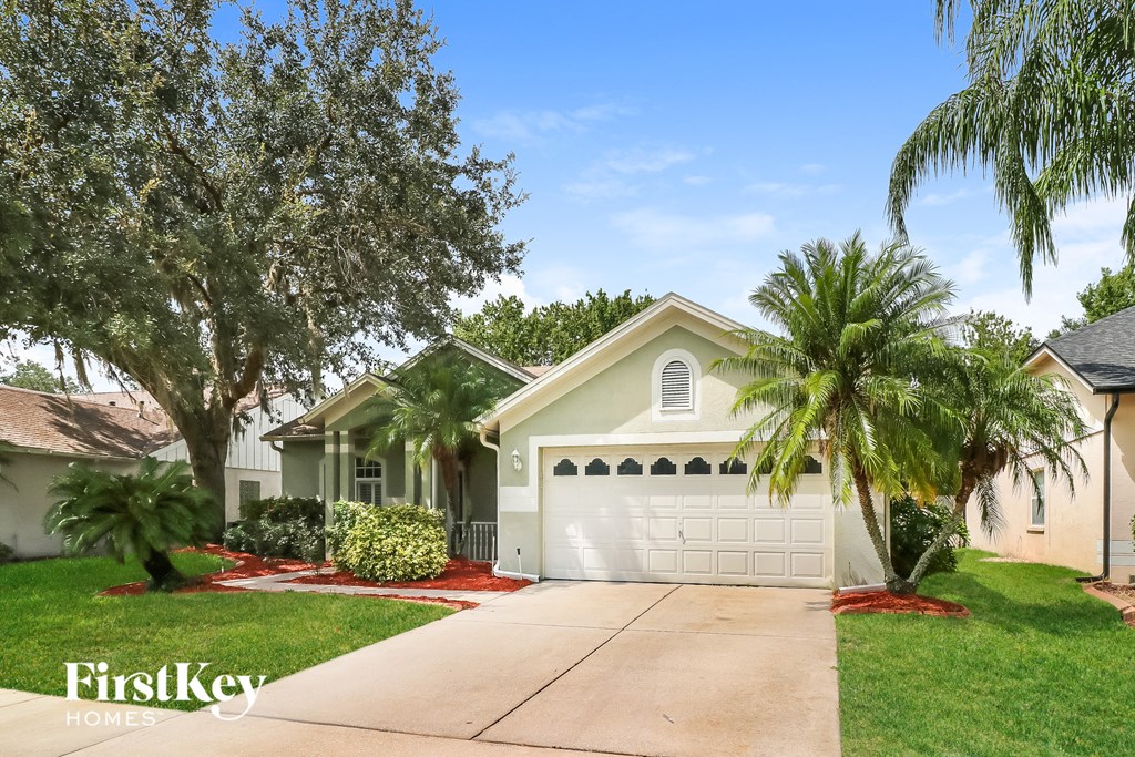 A house with a garage is for sale by FirstKey Homes.