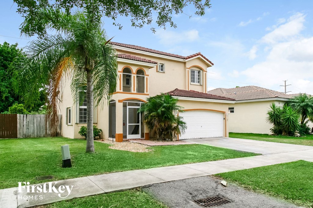 a house with a palm tree in front of it