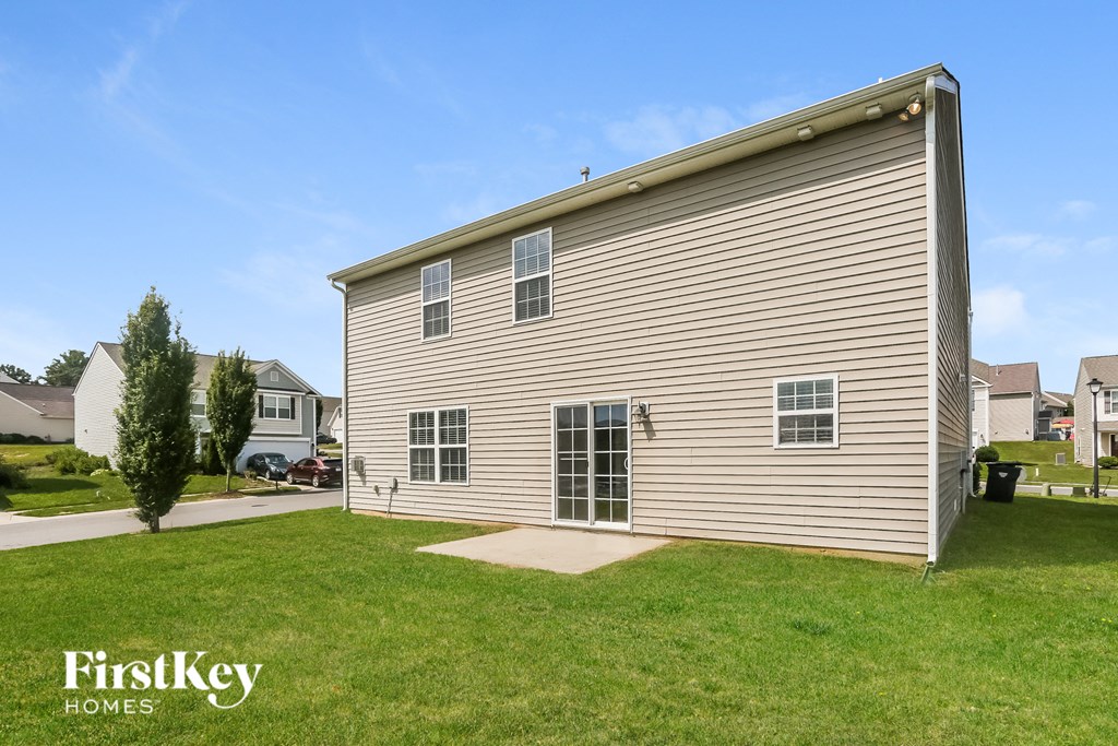 A house with a lawn in front of it.