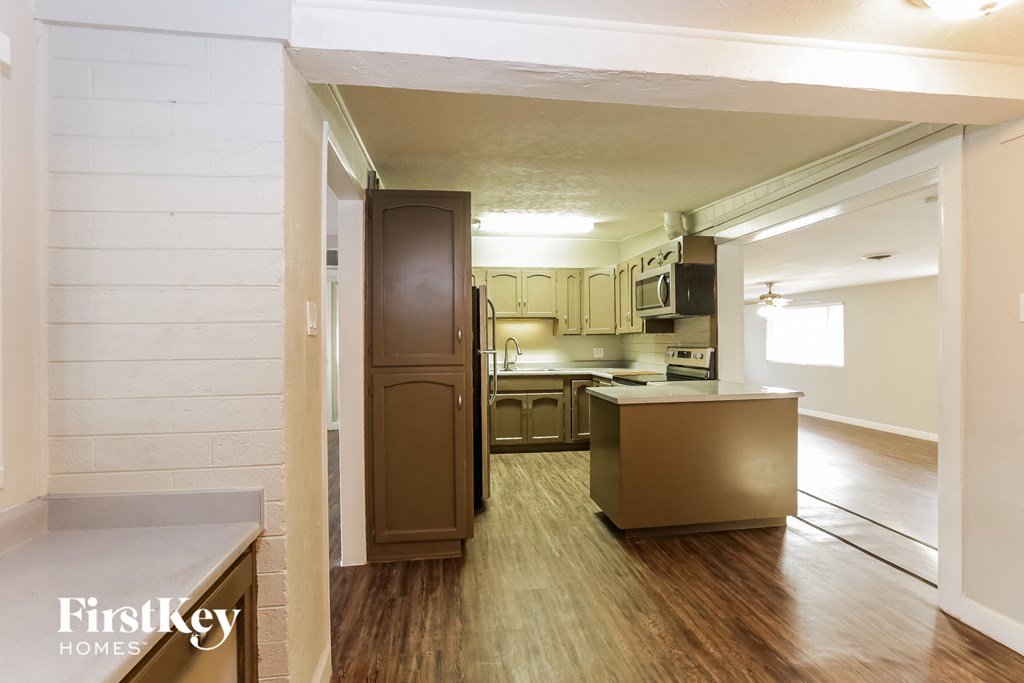 the view of the kitchen from the living room