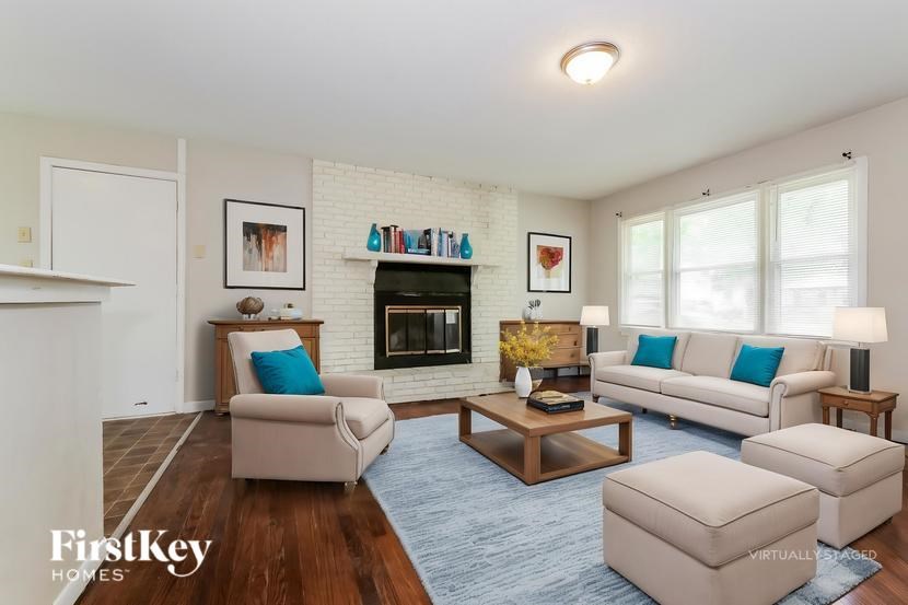 A living room with a fireplace and a couch.