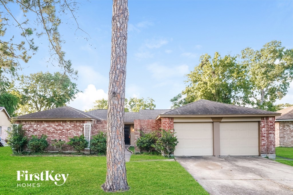 A house with a garage is for sale by FirstKey Homes.