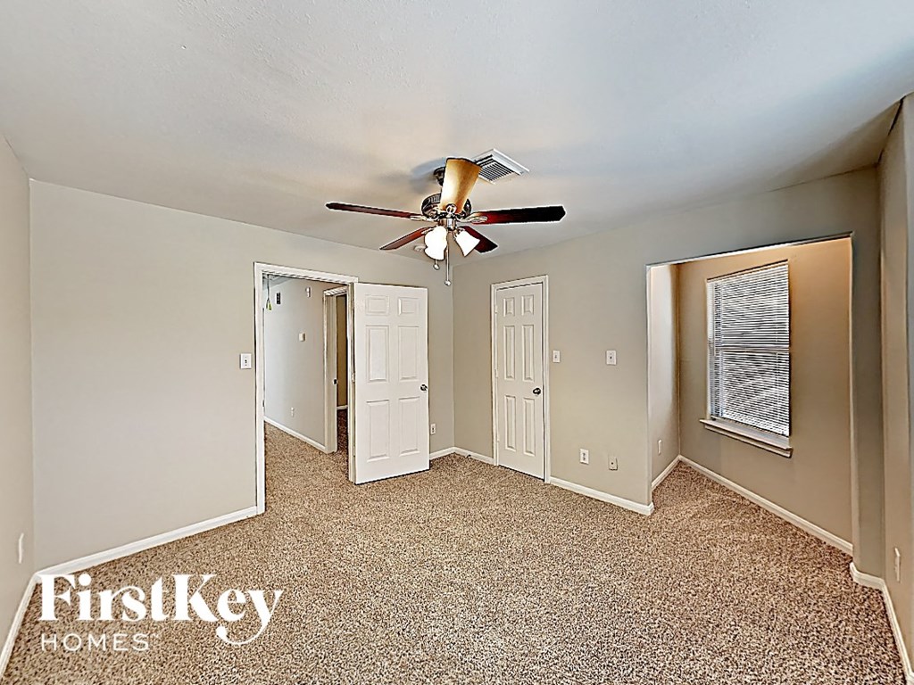 the master bedroom has a ceiling fan and plenty of closet space