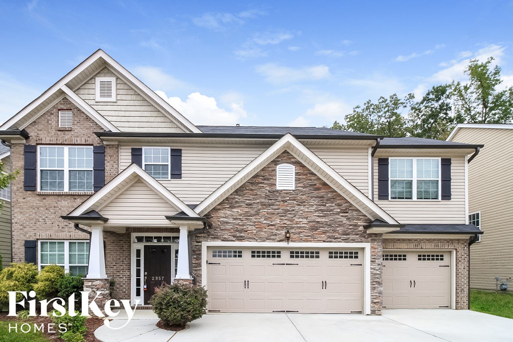 A two-story house with a garage is for sale by Firstkey Homes.