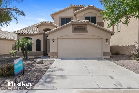 a house with a driveway and a garage door