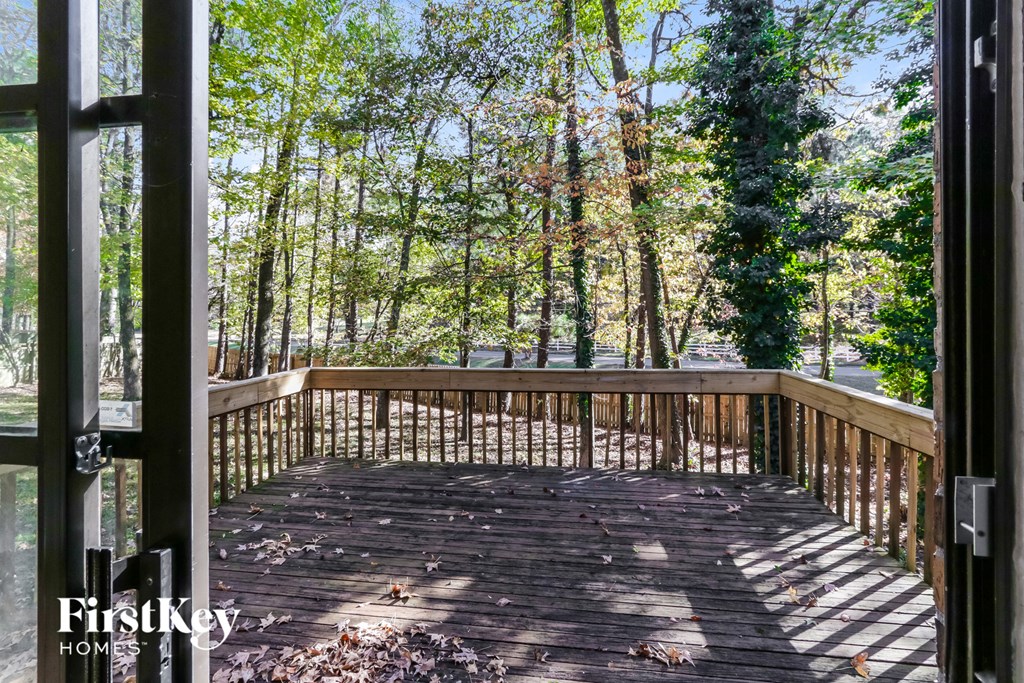 a deck with a view of the woods