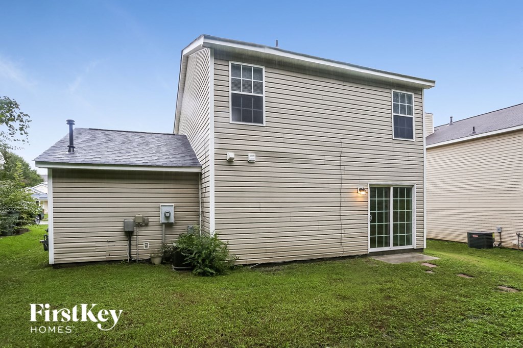 a side view of a house and a garage