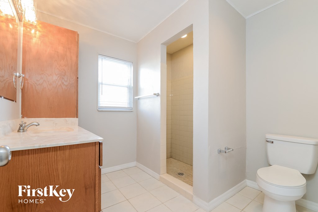 a small bathroom with a toilet and a shower