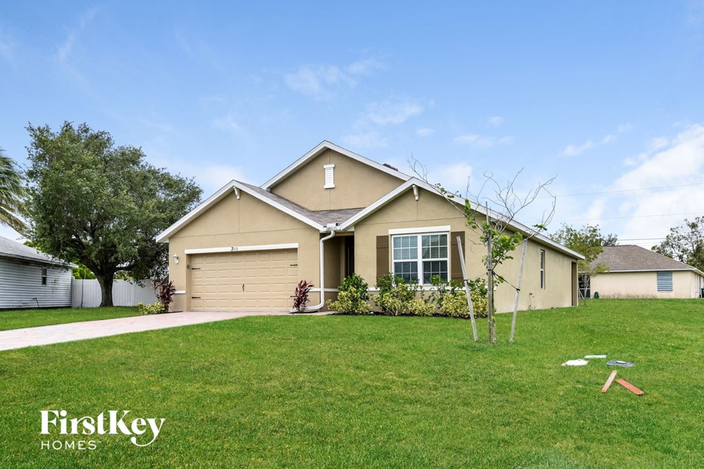 a house with a lawn in front of it