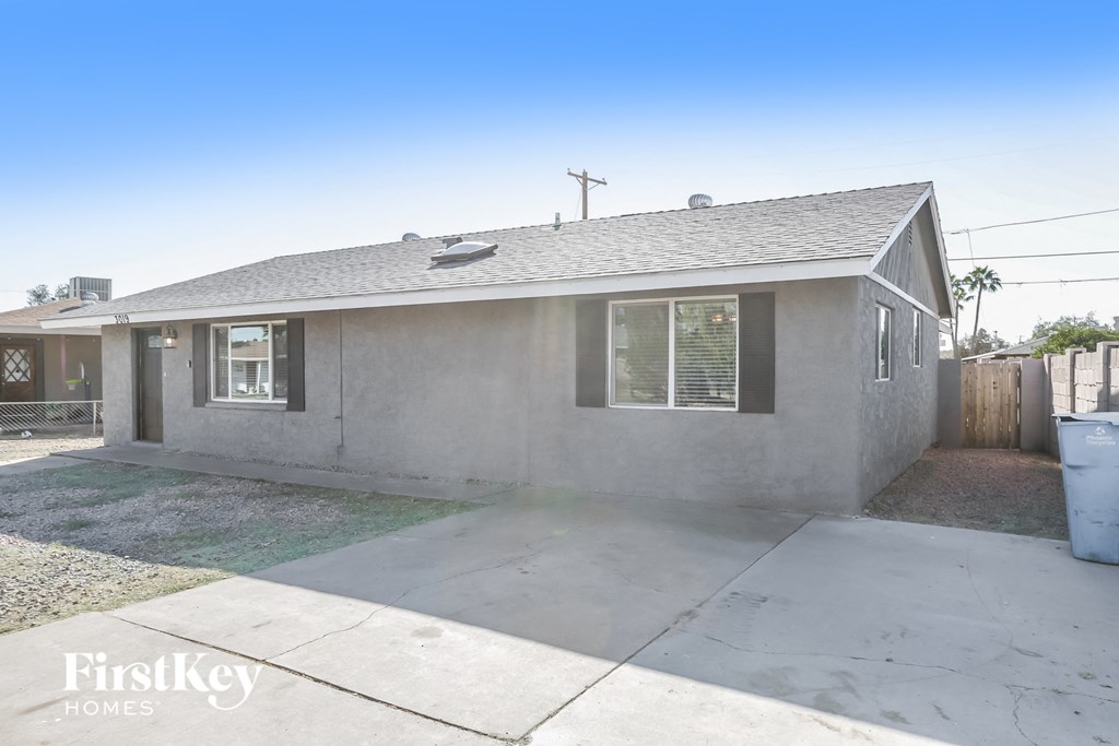 a small with a driveway and a roof