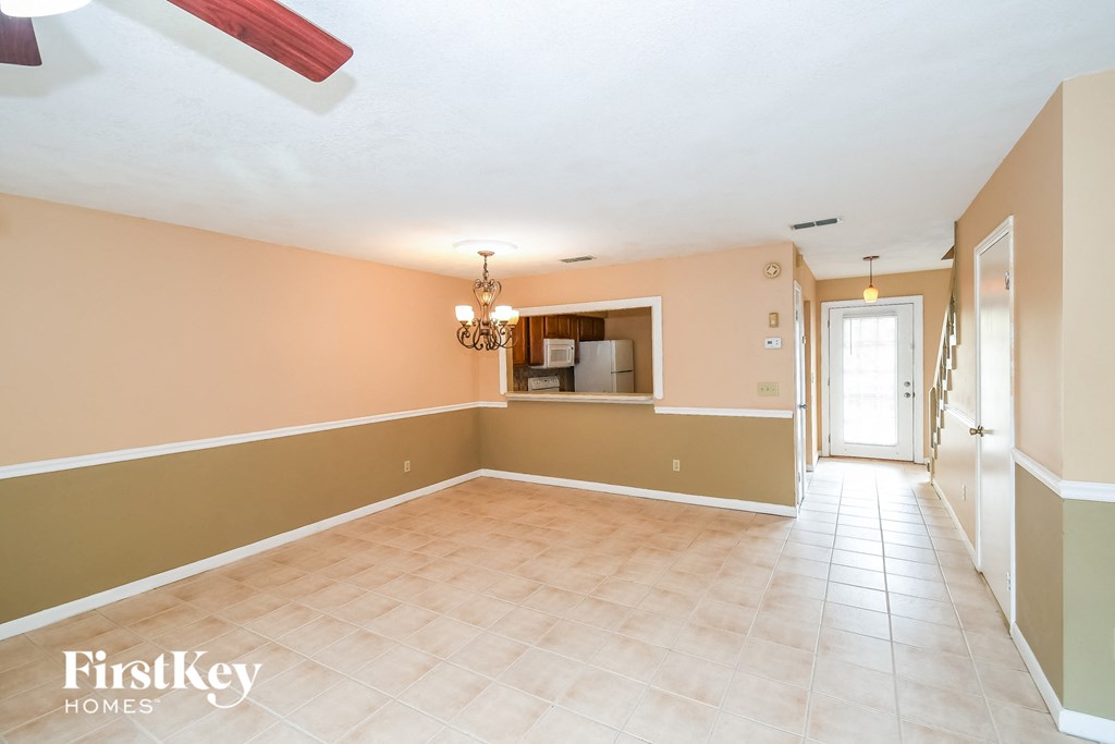 the dining room is open to the kitchen and living room