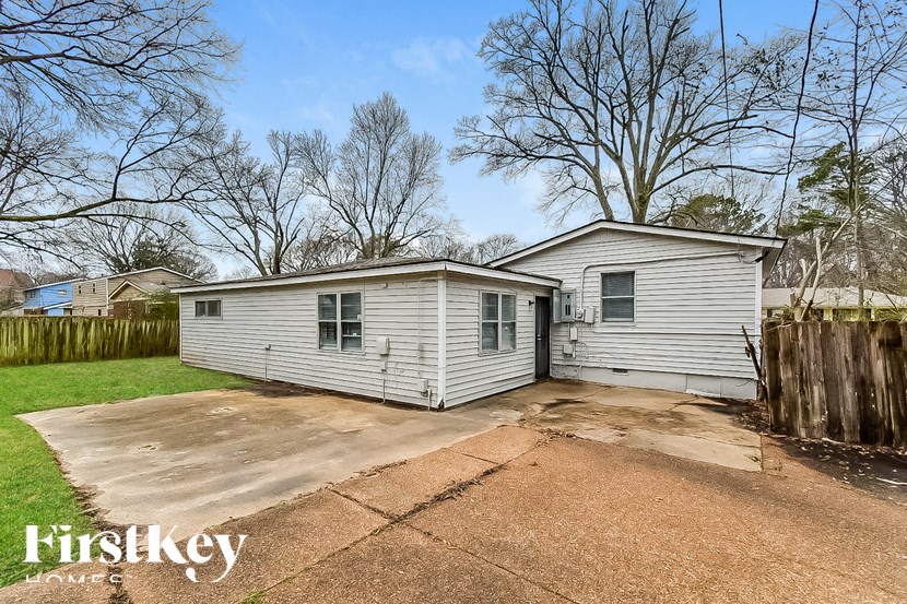 A two-story house with a garage is for sale.