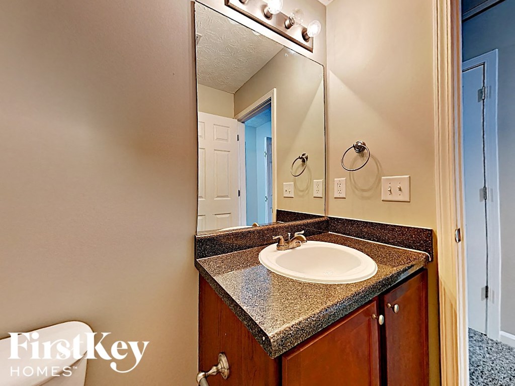 A bathroom sink with a mirror above it.