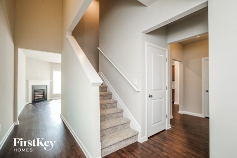 a view of a staircase in a home with a fireplace