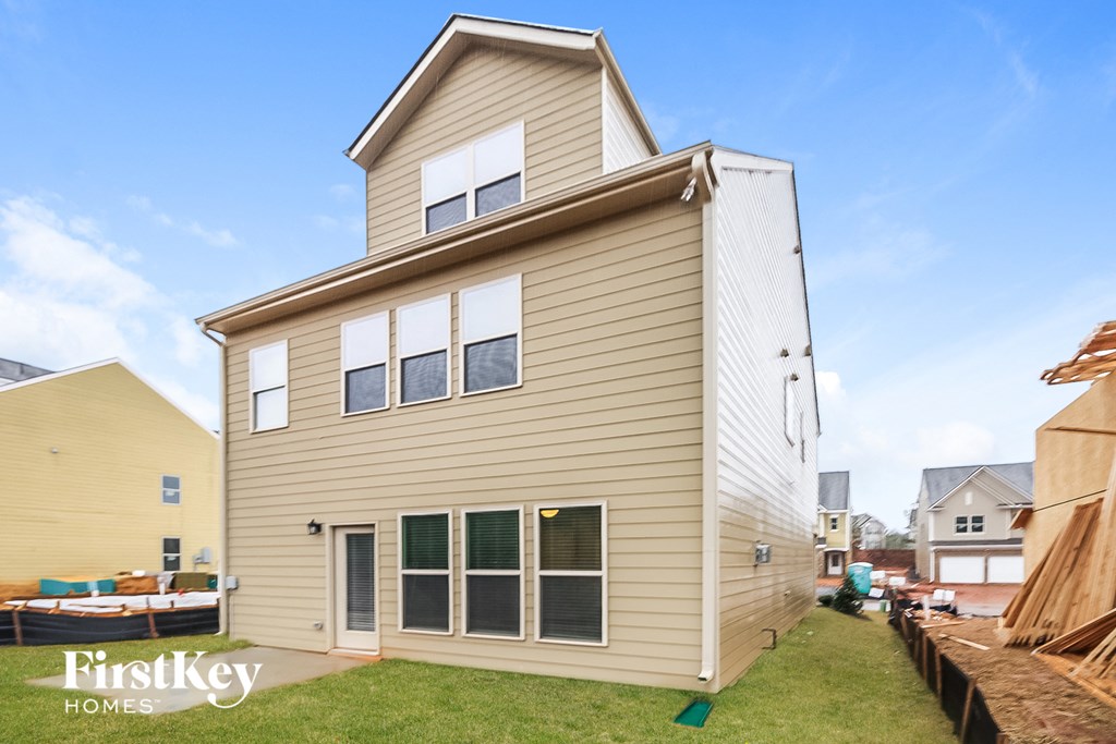 the back of the house with the garage and the roof removed