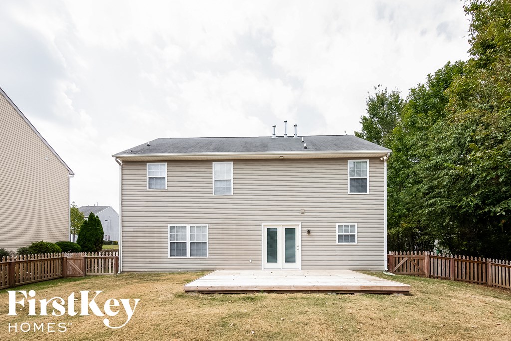 the back of a house with a ramp in front of it