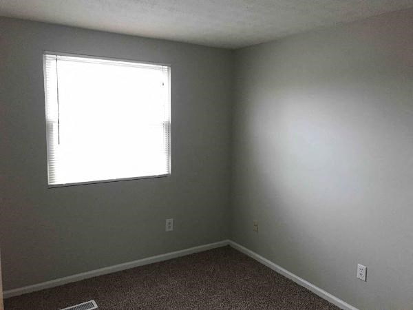 an empty room with a window in it