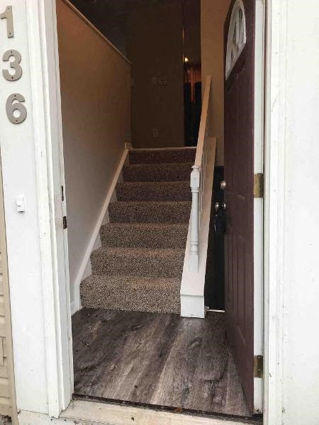 a set of stairs in a house with a door