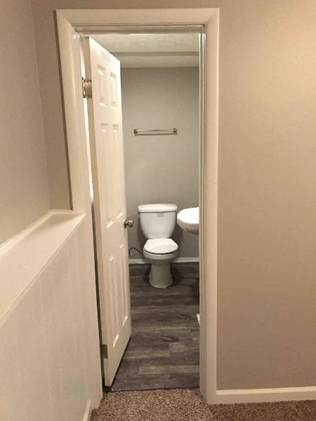 a bathroom with a toilet and a sink in it