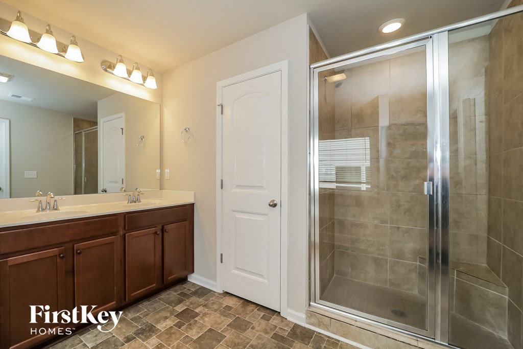the master ensuite bathroom has a large shower and two sinks