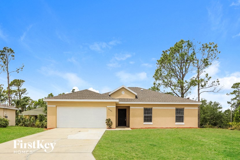 A house with a garage is for sale by FirstKey Homes.