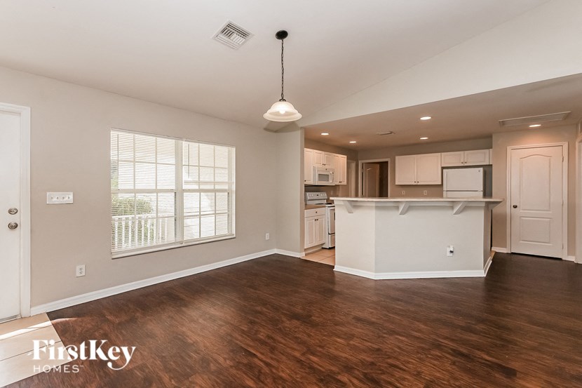 the kitchen and living room of an open floor plan