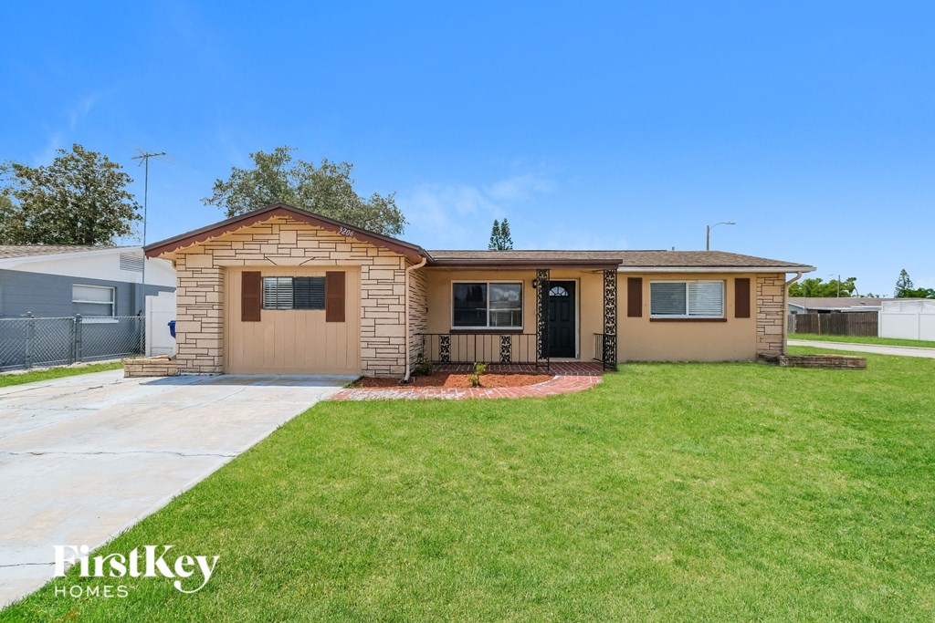 A house with a brown exterior and a black door is shown.