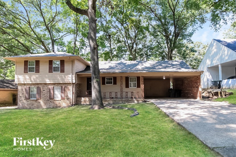 a house with a yard and a tree