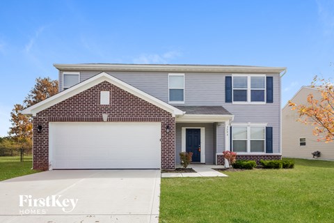 a blue house with a white garage door