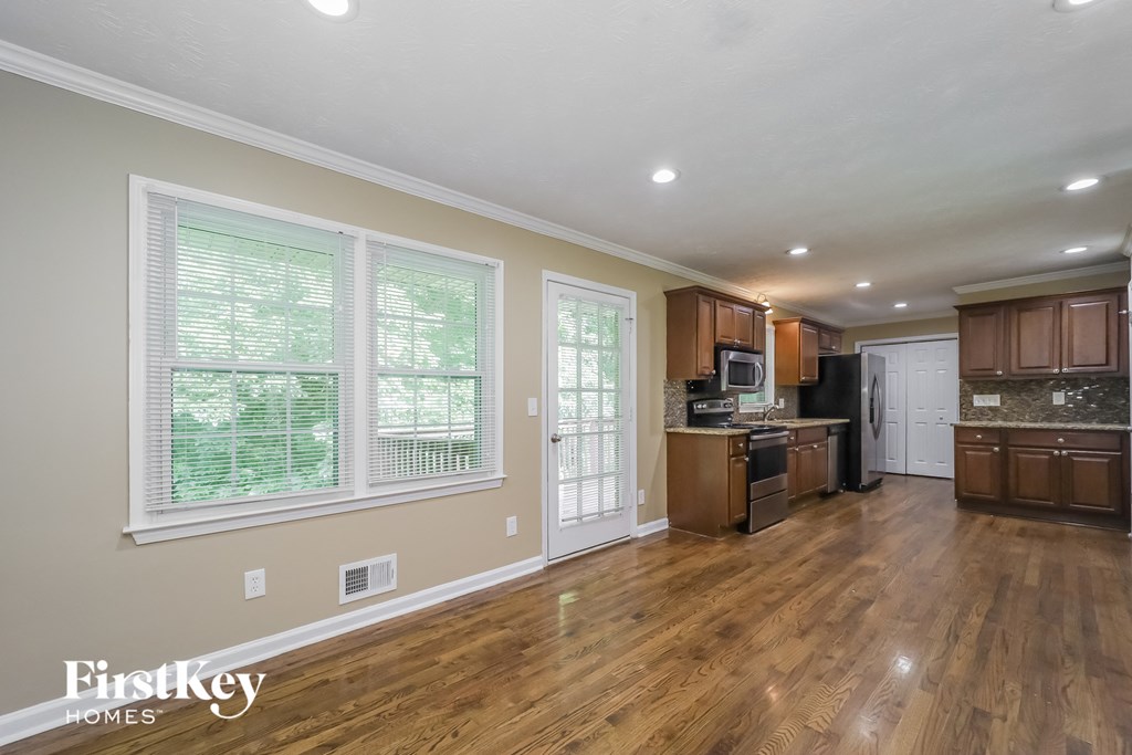 the kitchen is open to the dining room and living room