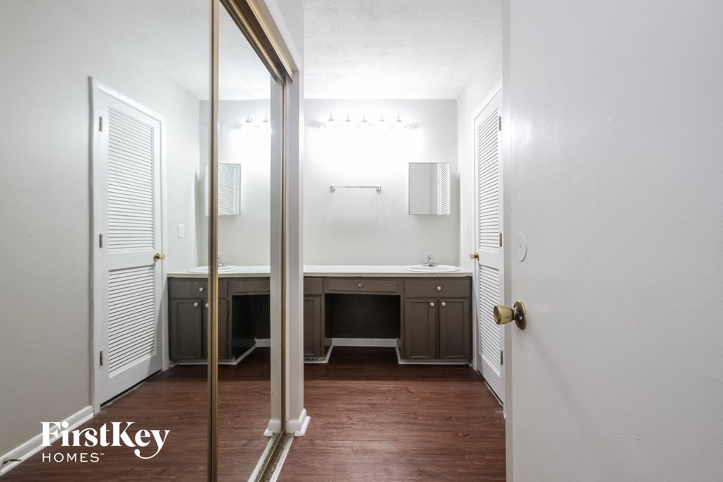a small bathroom with a mirror and a sink
