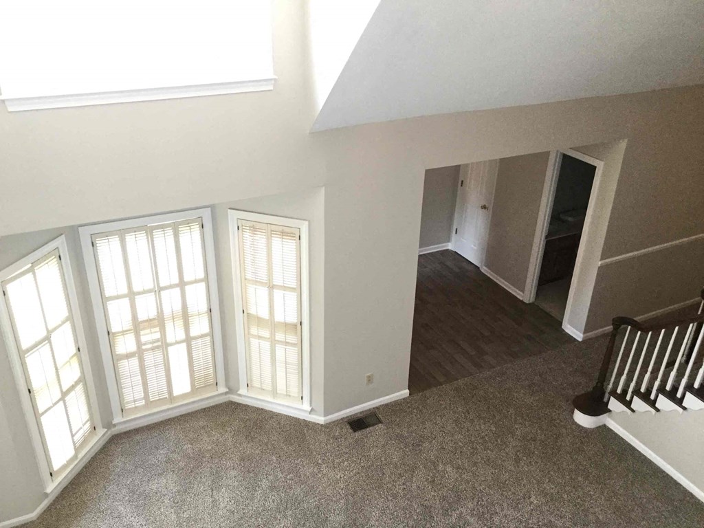 a view of the living room and dining room from the loft