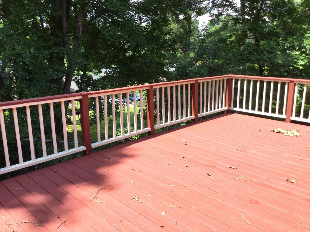 a composite deck with white railings on top of it