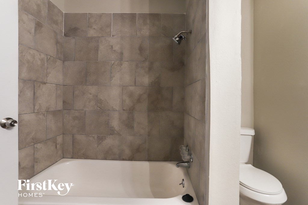 a small bathroom with a shower and a toilet