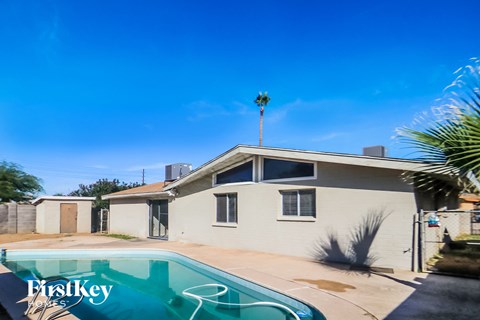 A house with a pool in the backyard.