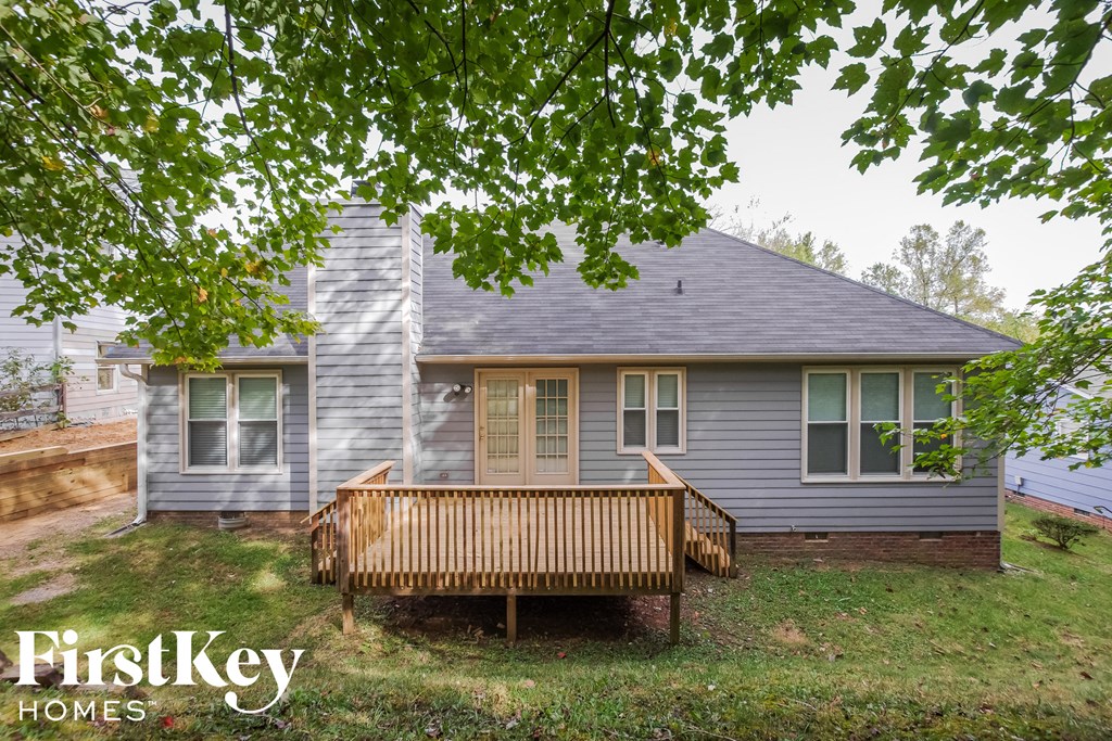 a house with a porch and a wooden deck