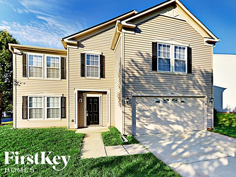 A two-story house with a garage is for sale by FirstKey Homes.