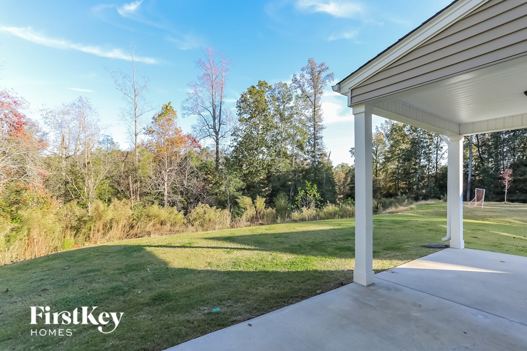 a view of the yard from the porch of a house