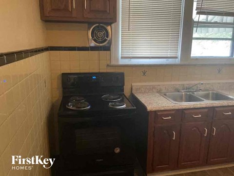 a small kitchen with a stove and a sink